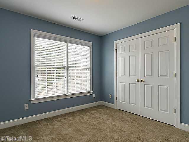 5403 Gray Leigh Drive Oak Ridge, NC 27310 - Photo 10 of 16 2nd Bedroom. This second bedroom 10 10" x 10 5" has double windows, large closet and it s own private bathroom.