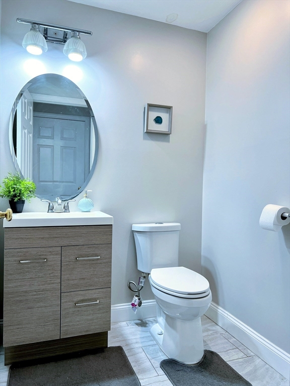 42 Evergreen Circle, Unit 42 Canton, MA 02021 - Photo 11 of 26 a bathroom with a toilet a sink and mirror