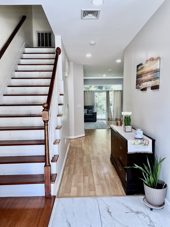 42 Evergreen Circle, Unit 42 Canton, MA 02021 - Photo 12 of 26 a living room with furniture and wooden floor