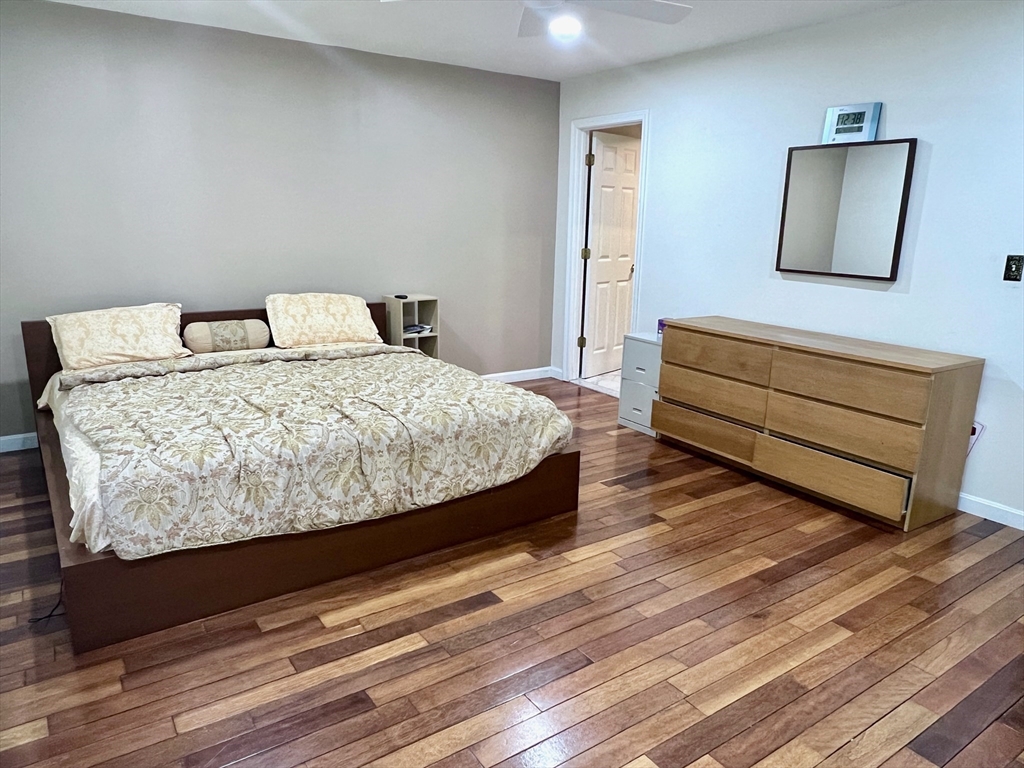 42 Evergreen Circle, Unit 42 Canton, MA 02021 - Photo 14 of 26 a bedroom with a bed and a dresser