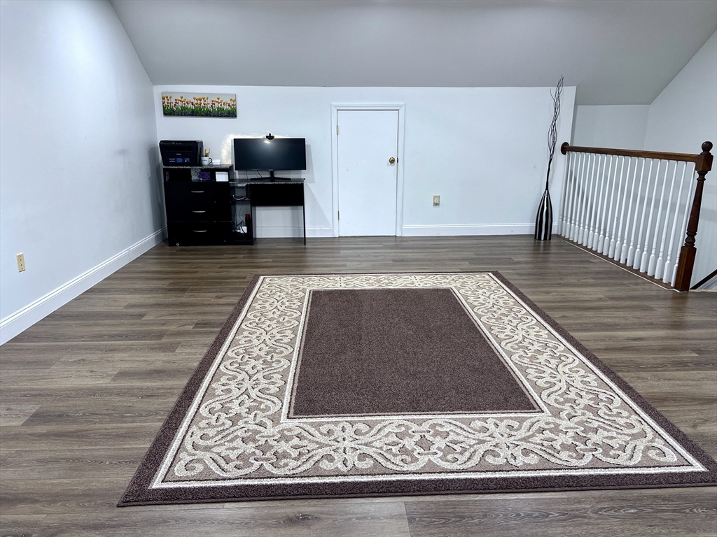 42 Evergreen Circle, Unit 42 Canton, MA 02021 - Photo 22 of 26 a living room with a rug