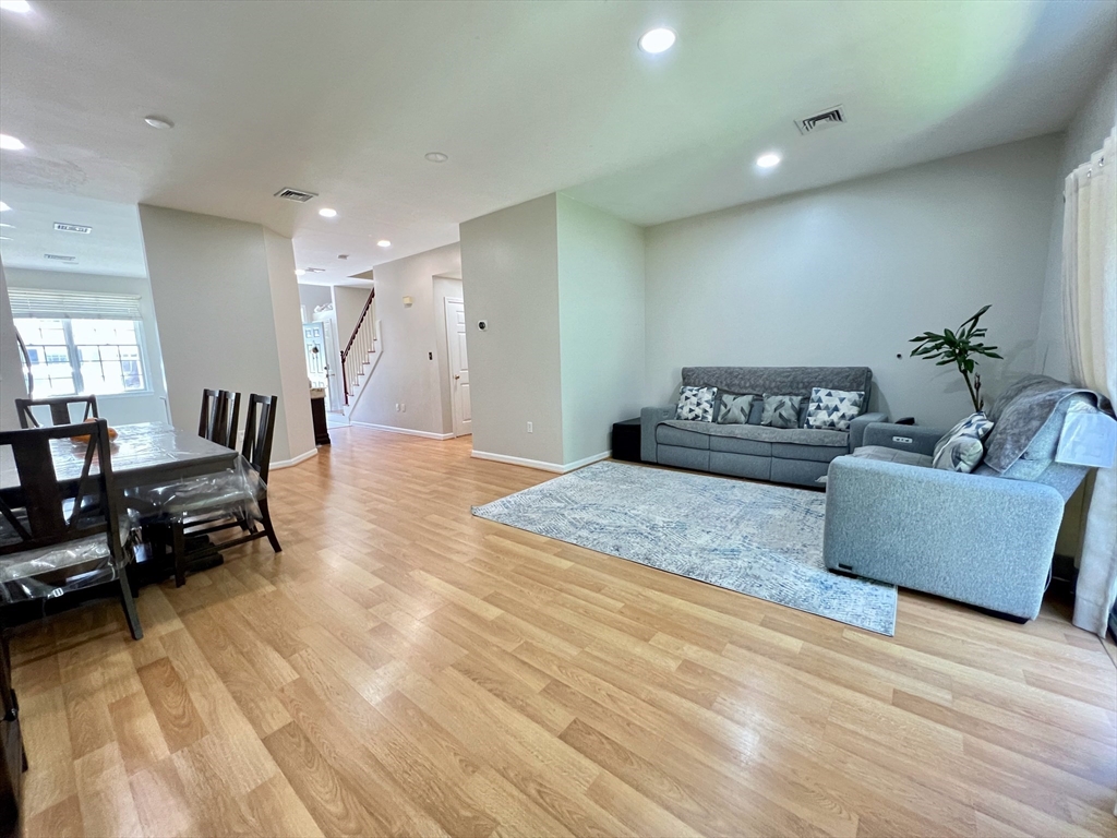 42 Evergreen Circle, Unit 42 Canton, MA 02021 - Photo 3 of 26 a living room with furniture and a wooden floor