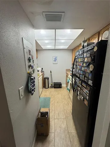 a kitchen with stainless steel appliances wooden cabinets and a stove top oven