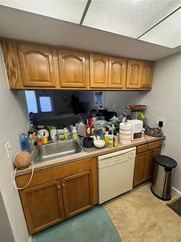 a room with a couch and chandelier