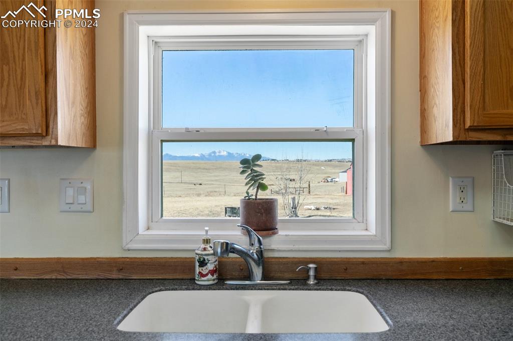 18830 Kevin's View Peyton, CO 80831 - Photo 18 of 37 Enjoy the spectacular view of Pikes Peak and the amazing mountain range from the kitchen window.