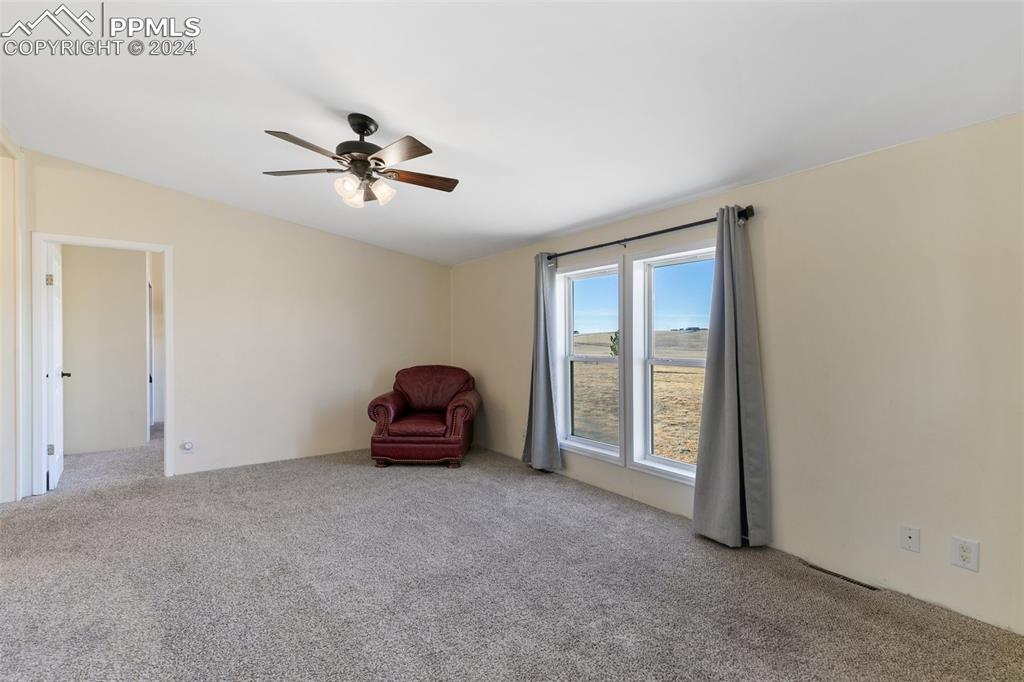 18830 Kevin's View Peyton, CO 80831 - Photo 22 of 37 Roomy family room area with easy access to 3 of the bedrooms