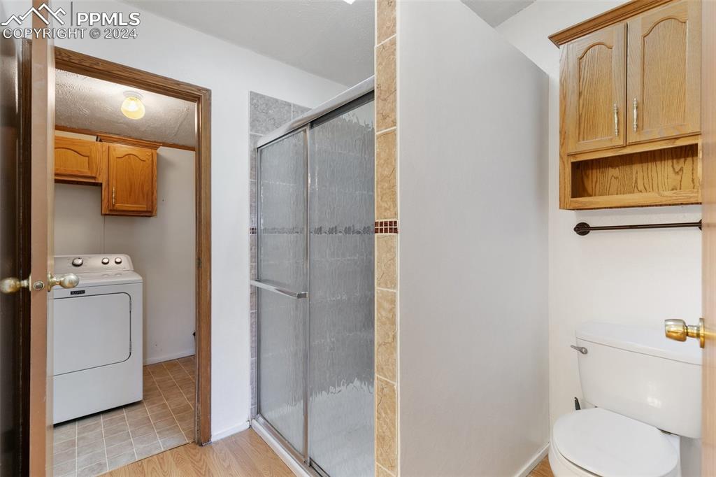 18830 Kevin's View Peyton, CO 80831 - Photo 24 of 37 Primary bathroom features an oversized free-standing shower, adjoins the primary bedroom and laundry/mud room area.