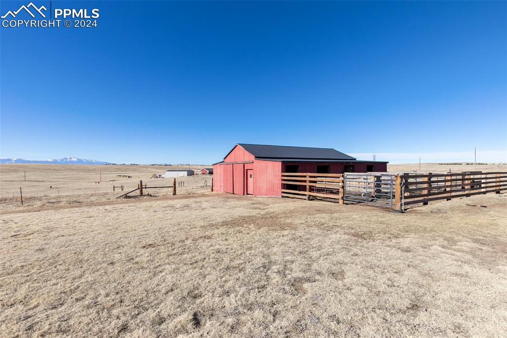 18830 Kevin's View Peyton, CO 80831 - Photo 31 of 37 Check out this well built 40'x40' metal barn featuring 4 separate stalls, each with their own runs!