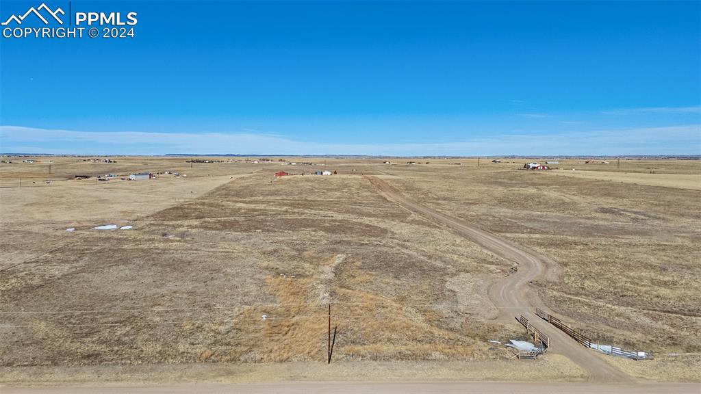18830 Kevin's View Peyton, CO 80831 - Photo 34 of 37 Aerial view of the property looking north from the road shows the driveway and lower pasture, which is separately fenced.