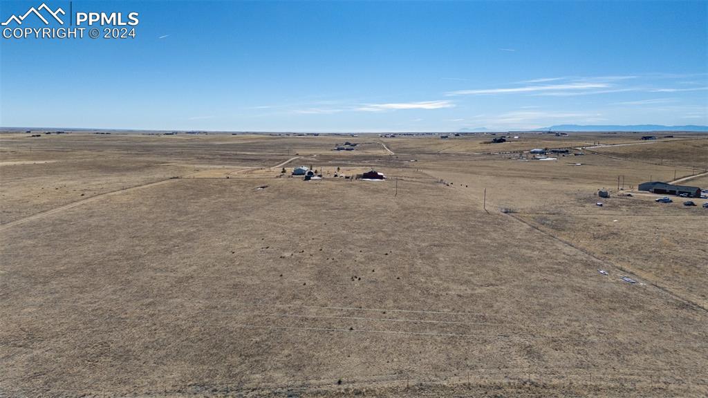 18830 Kevin's View Peyton, CO 80831 - Photo 36 of 37 Aerial view from the north property line looking south towards the home and barn - upper pasture.
