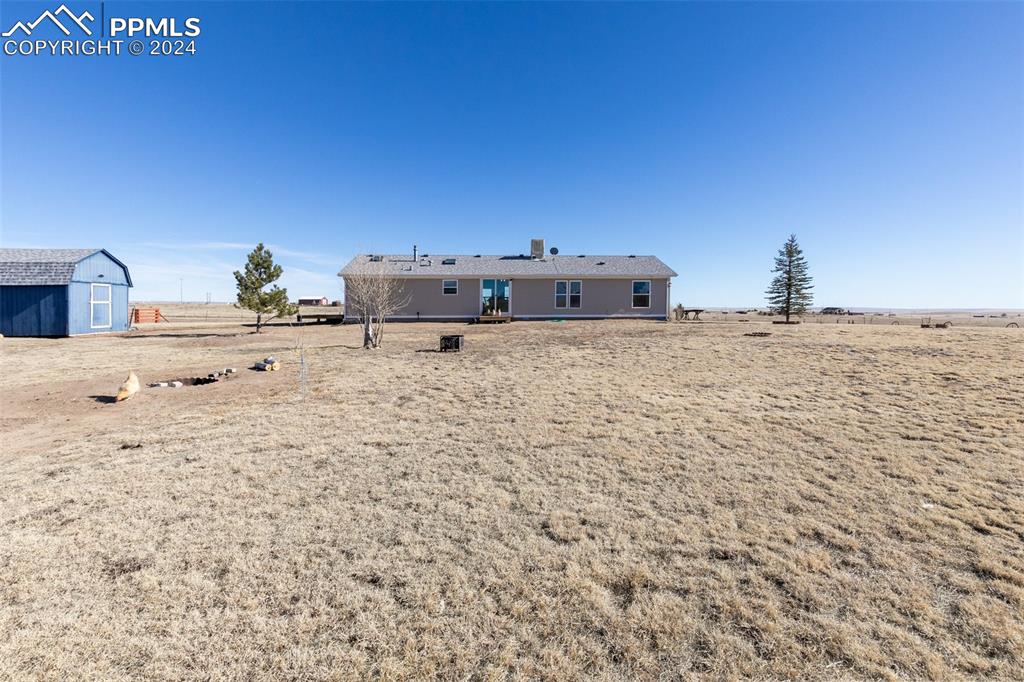 18830 Kevin's View Peyton, CO 80831 - Photo 4 of 37 Looking east at the backside of the home