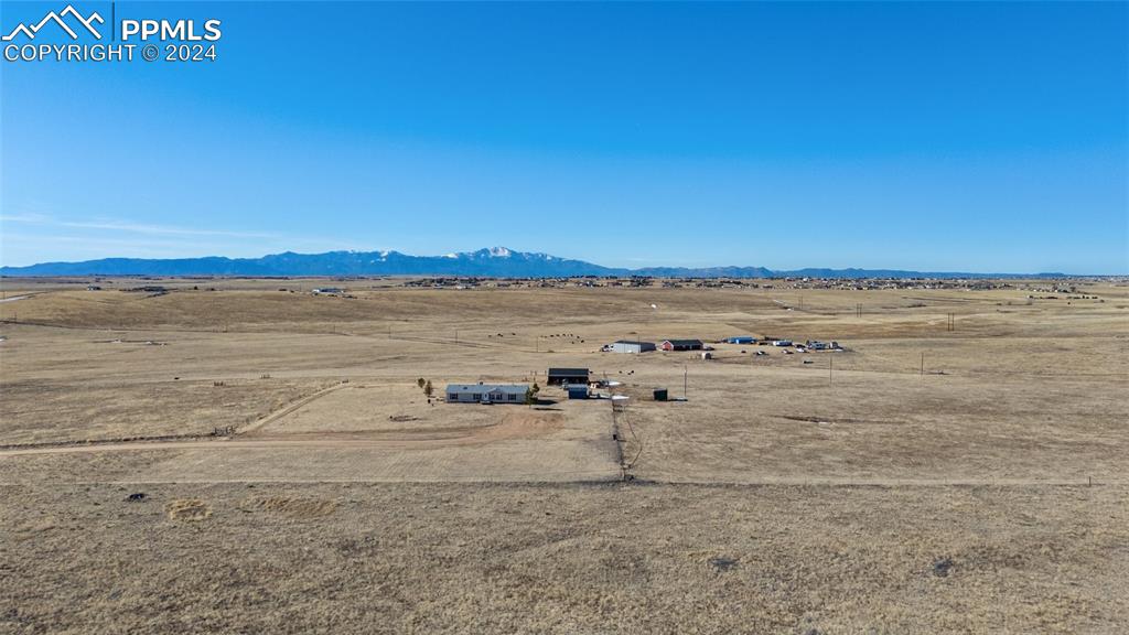 18830 Kevin's View Peyton, CO 80831 - Photo 7 of 37 Birds eye view of the home and out buildings showing the rural surroundings.