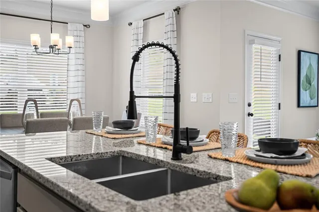 a kitchen with a sink and cabinets