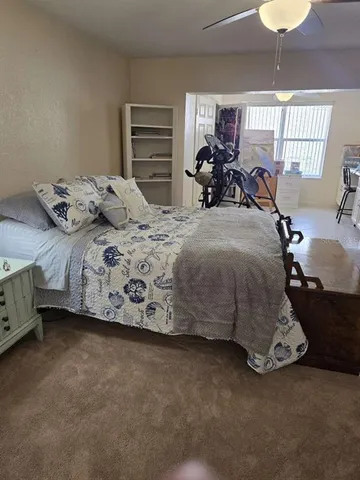 a living room with furniture and a mirror