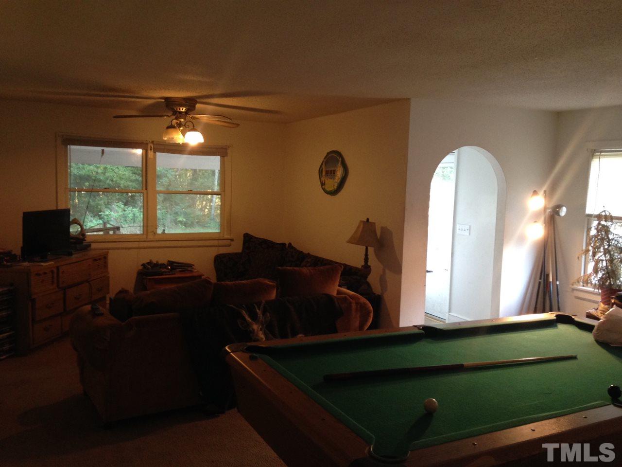 2124 Lizard Lick Road Zebulon, NC 27597 - Photo 6 of 9 a living room with furniture and a window