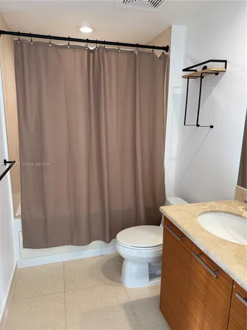 a bathroom with a sink and toilet