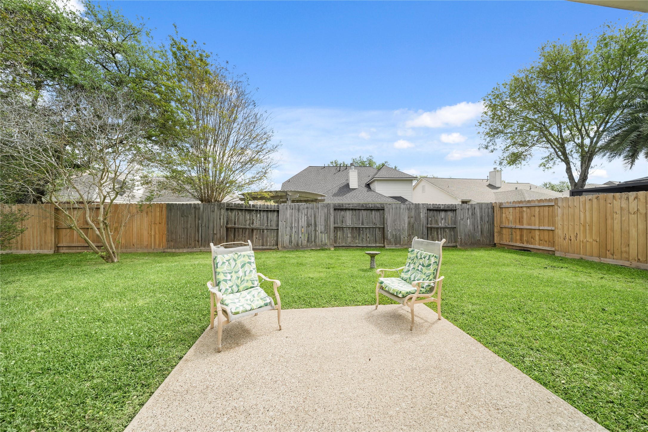 8134 Blue Jay Street Baytown, TX 77523 - Photo 27 of 31 The expansive backyard presents a generous canvas for outdoor living, featuring ample space for landscaping and a substantial slab ideal for creating a customized outdoor retreat.