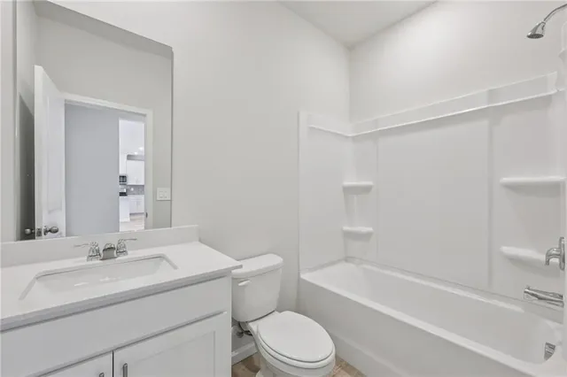 a bathroom with a sink toilet and a bathtub