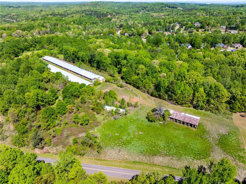 622 Pocket Road Pendergrass, GA 30567 - Photo 9 of 25 an aerial view of residential houses with outdoor space and trees