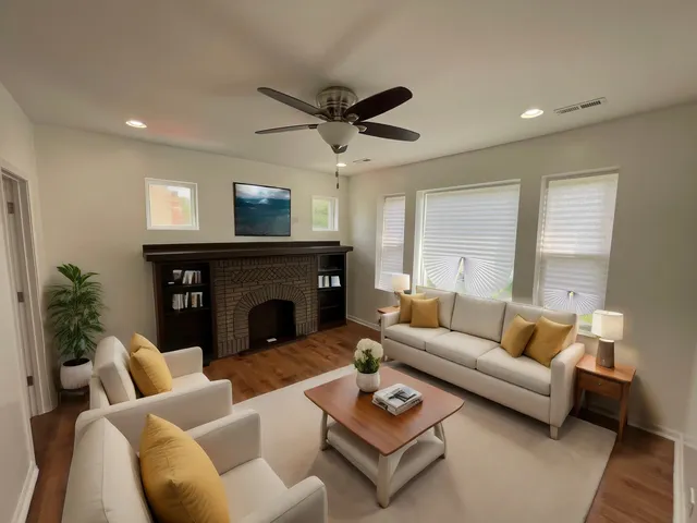 a living room with furniture and a fireplace