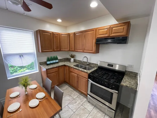a kitchen with a stove a sink and a microwave