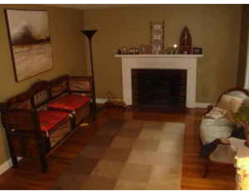 47 Stone Road Arlington, MA 02474 - Photo 4 of 10 a view of livingroom with furniture and a fireplace
