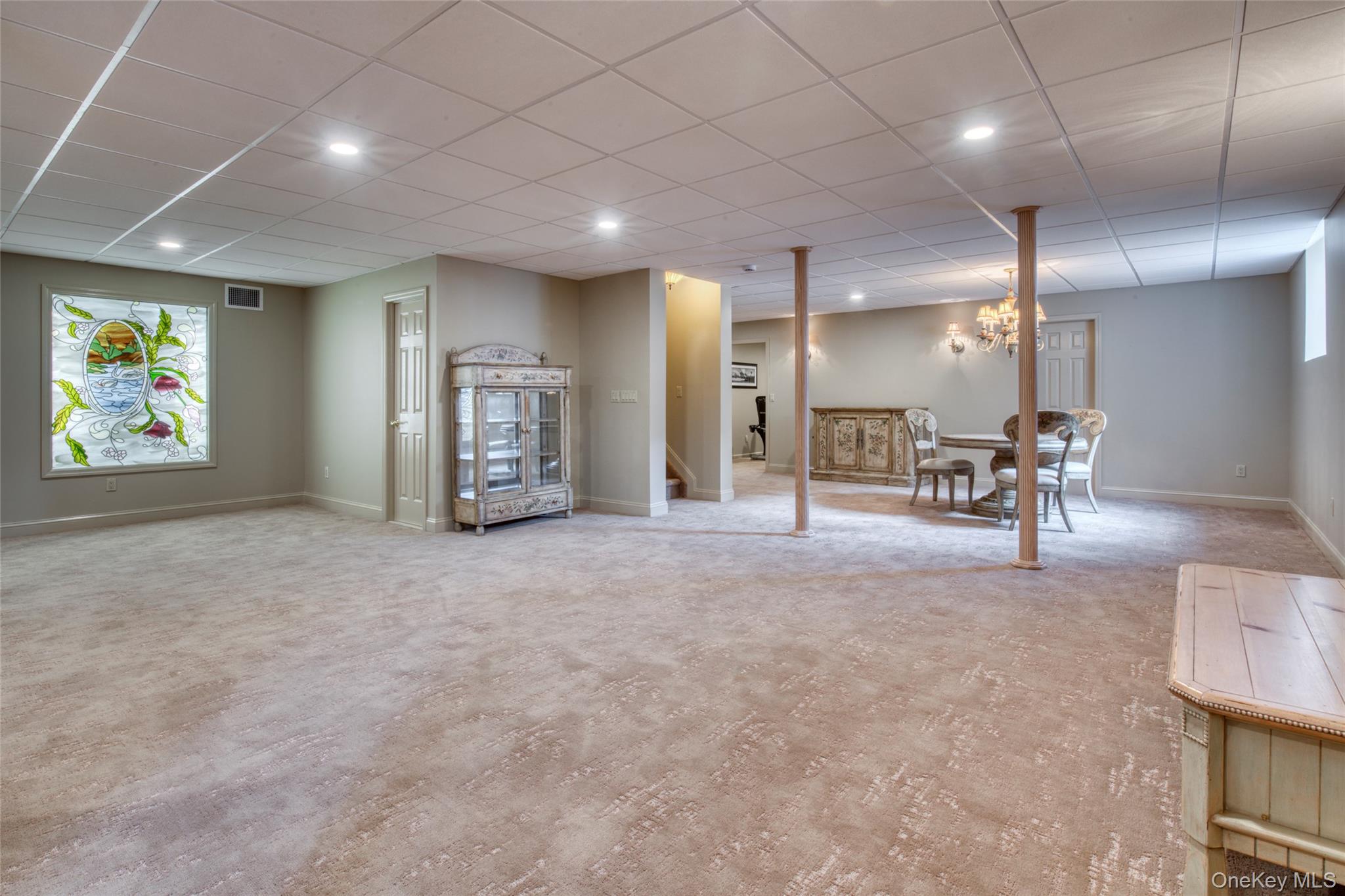 395 Stonecrop Road Riverhead, NY 11901 - Photo 23 of 38 Renovated basement w/new hi-hats, new carpeting