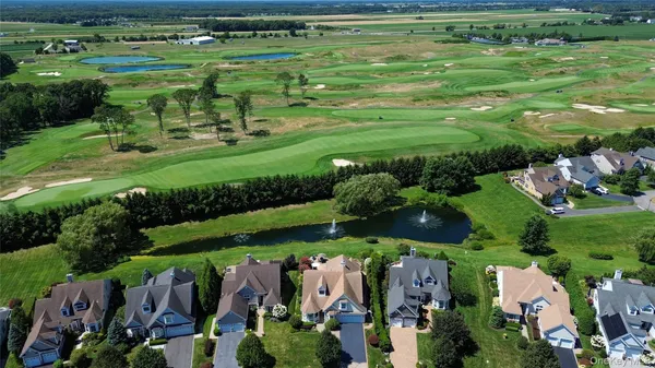 a view of a golf course with parking space