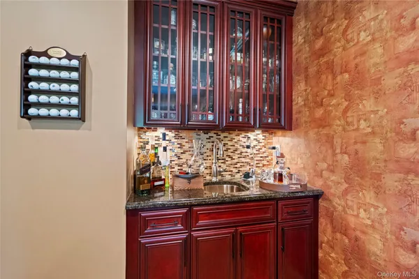 a kitchen with sink and cabinets
