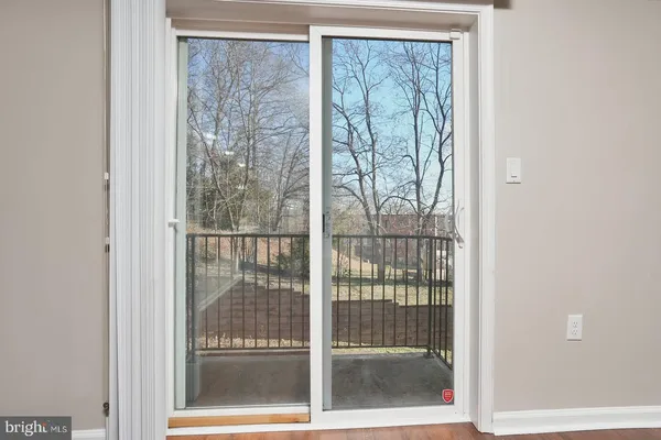 a view of a glass door and a window