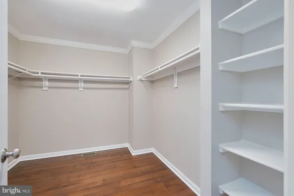 a view of an empty walk in closet