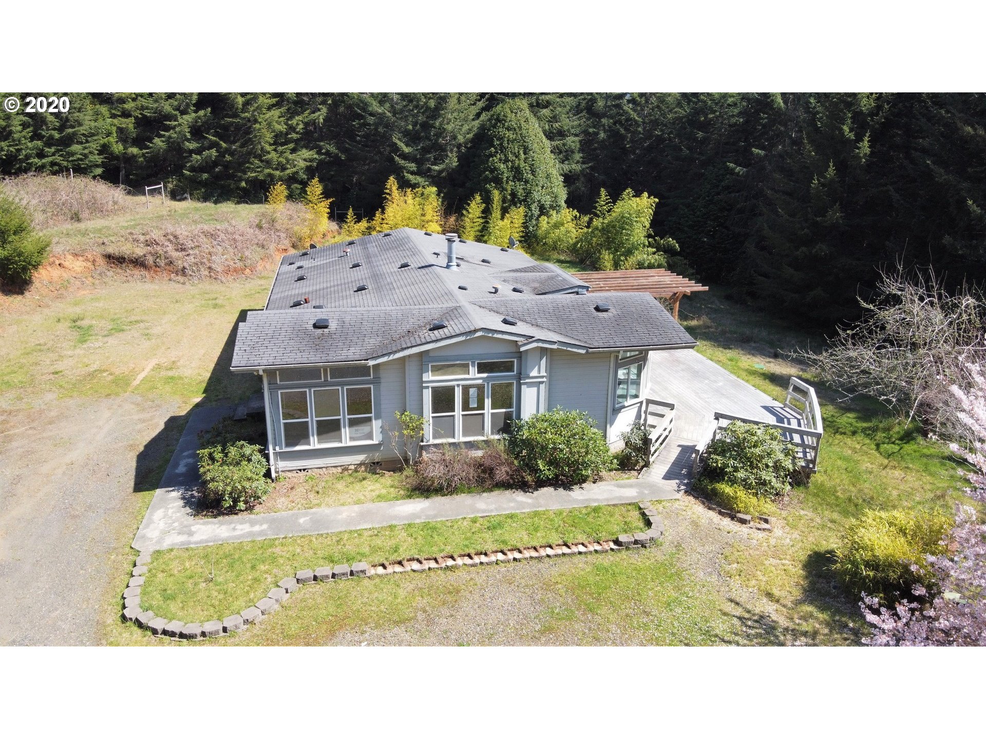 65477 Elk Ridge Road North Bend, OR 97459 - Photo 3 of 32 a view of houses with yard