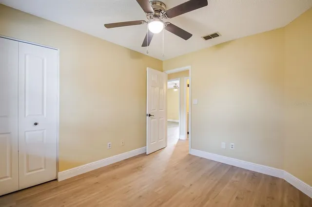 a view of an empty room and wooden floor
