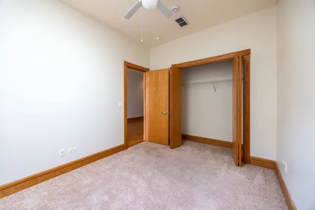 a bathroom with a bathtub shower sink vanity mirror and toilet
