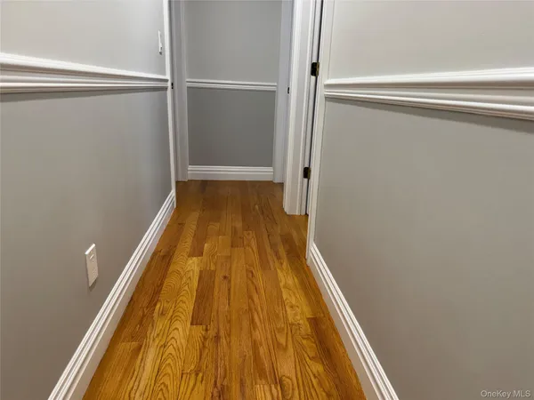 a view of a balcony with wooden floor