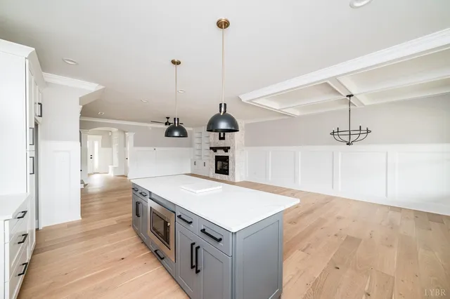 a kitchen with a sink and large window
