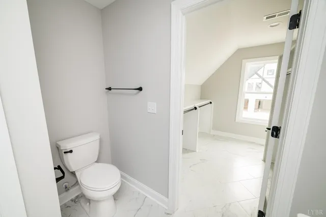 a bathroom with a sink a mirror and shower
