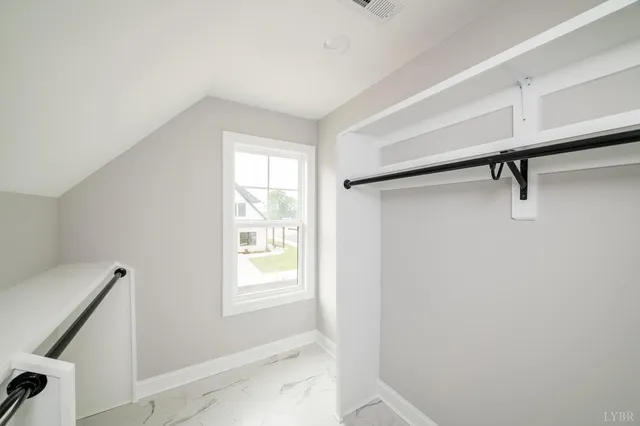 a white toilet sitting next to a bath tub and a shower