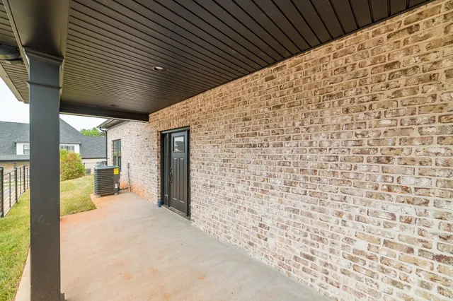 a view of a house with a garden and swimming pool
