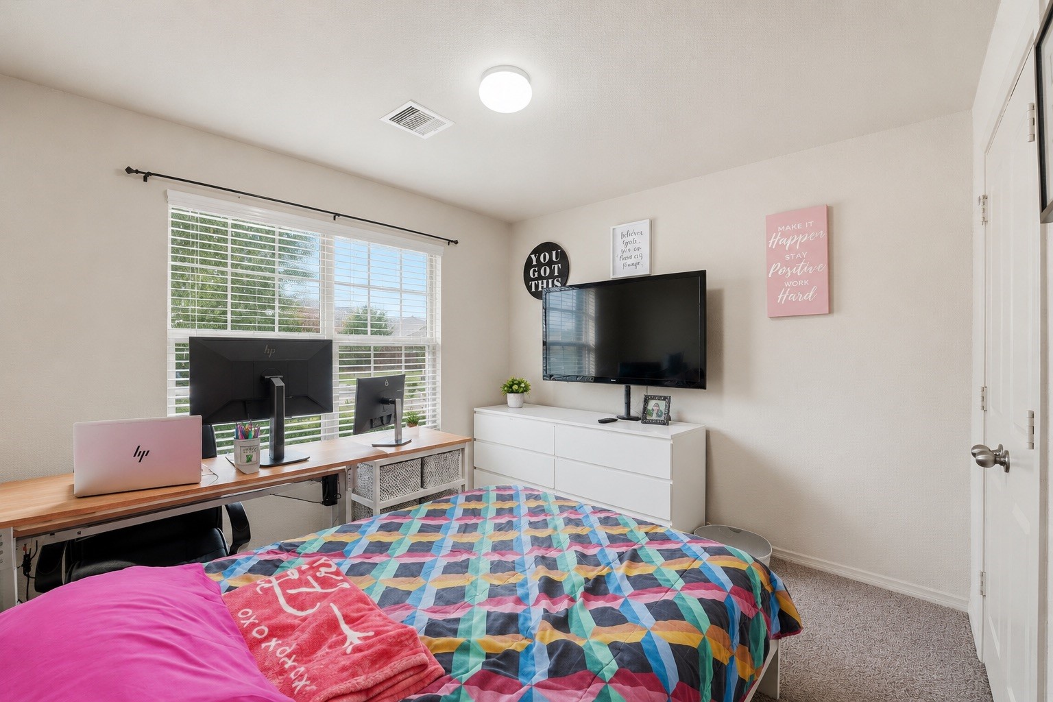 15455 Rancho Joya Way Houston, TX 77049 - Photo 15 of 20 a bedroom with a bed and a flat screen tv