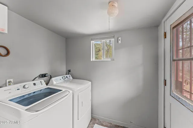 a utility room with dryer and washer