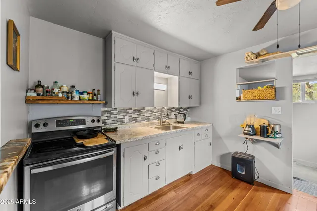 a kitchen with a stove and a sink