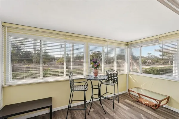 a window and a table in a balcony