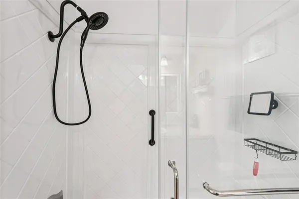 a bathroom with sink granite and mirror