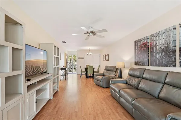 a view of a dining room with furniture and wooden floor