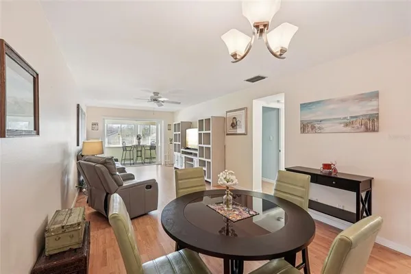a kitchen with stainless steel appliances a sink a stove a microwave and cabinets