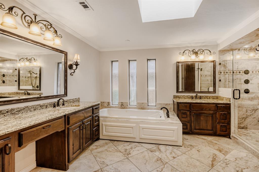 6108 Bluff Point Drive Dallas, TX 75248 - Photo 12 of 28 a spacious bathroom with a tub sink and mirror
