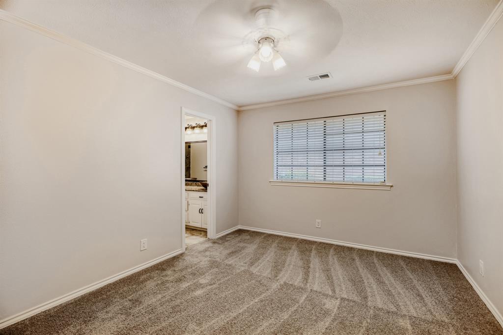 6108 Bluff Point Drive Dallas, TX 75248 - Photo 14 of 28 an empty room with windows and cabinet