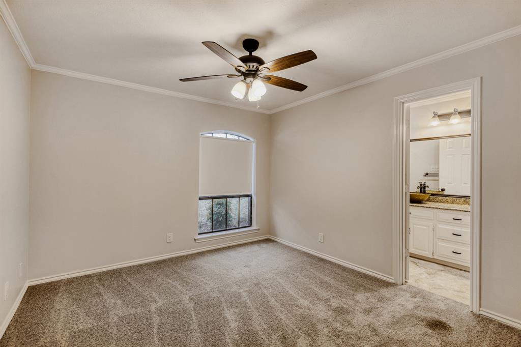 6108 Bluff Point Drive Dallas, TX 75248 - Photo 15 of 28 a view of an empty room with window and cabinet