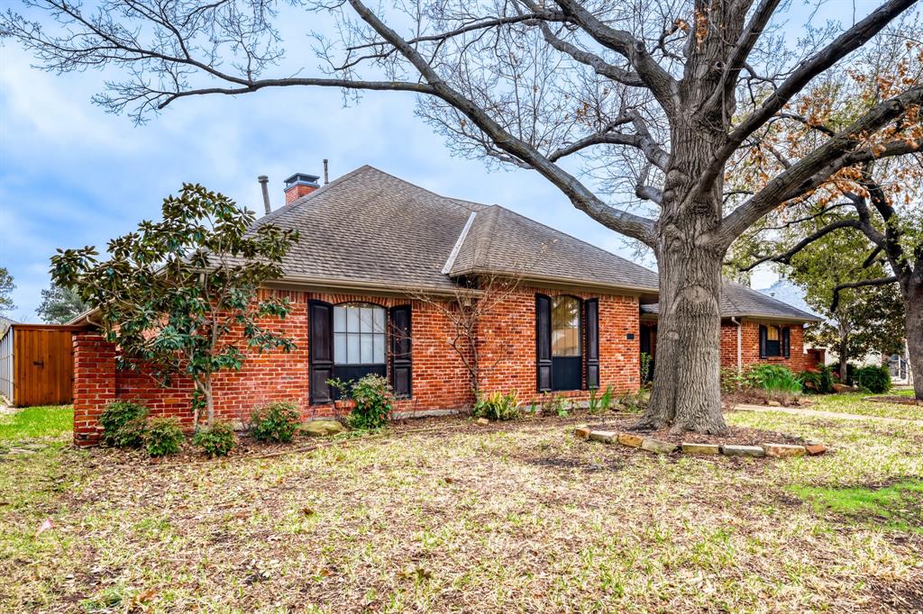 6108 Bluff Point Drive Dallas, TX 75248 - Photo 2 of 28 a front view of a house with a yard